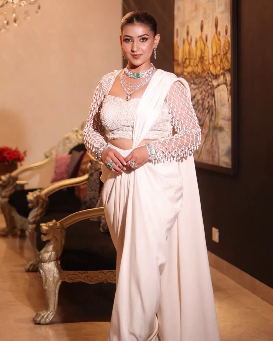 white indo western satin drape outfit with embellished blouse and drape skirt