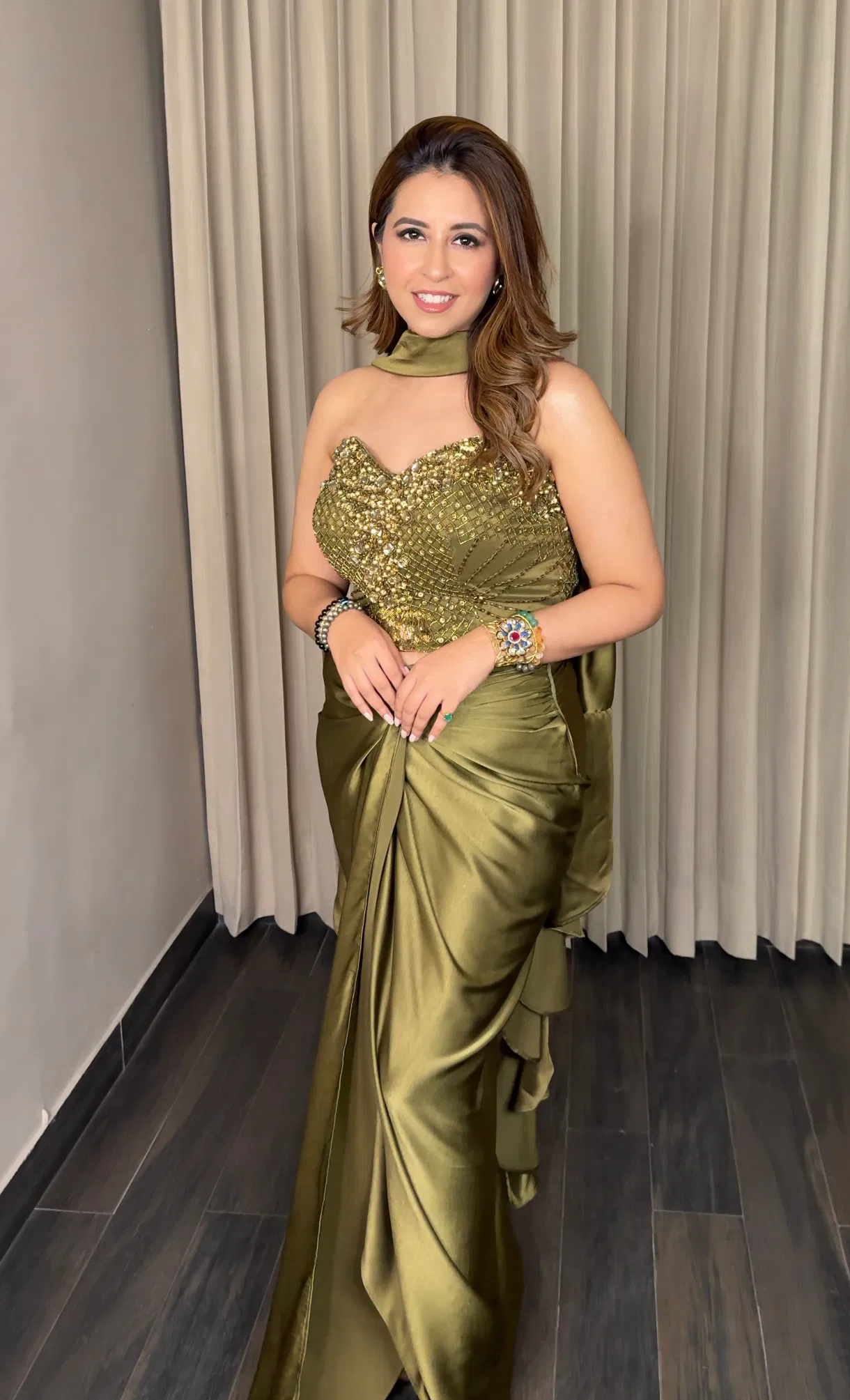 olive green drape saree with embroidered corset